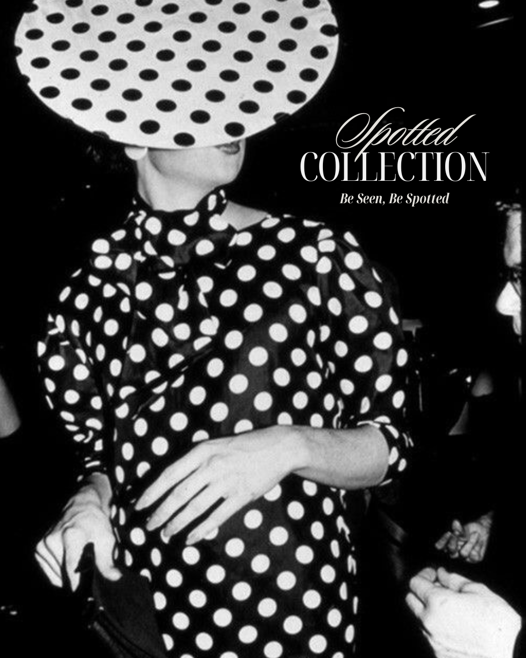 Person wearing a black and white polka dot dress with a large polka dot headpiece, featuring the text 'Spotted Collection'.