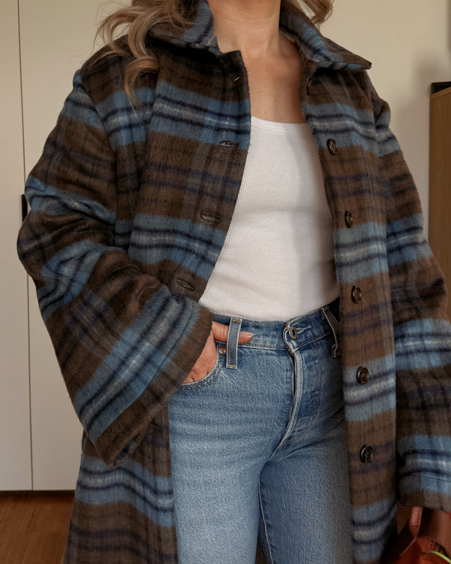 Model wearing The Tailored Coat by By Bel in an espresso and powder blue heritage check with a relaxed straight-cut silhouette