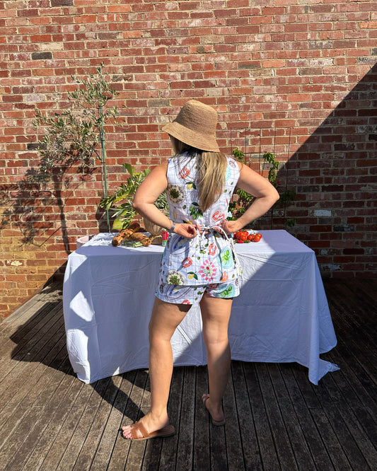 Tie back and flared hem detail on Mediterranean-inspired summer top