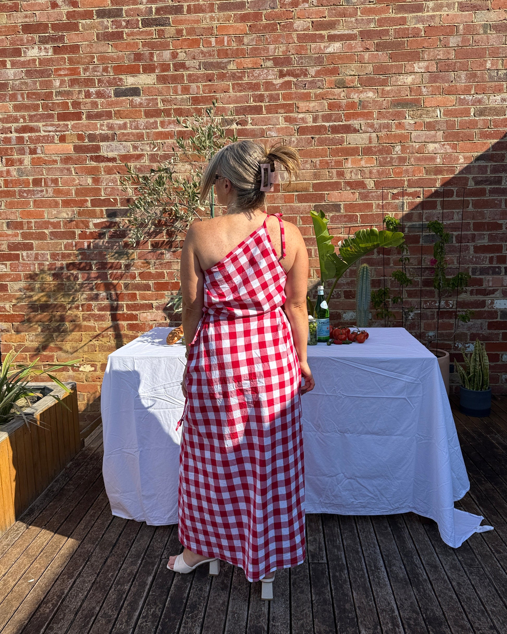 European summer outfit featuring flowing gingham maxi dress by By Bel