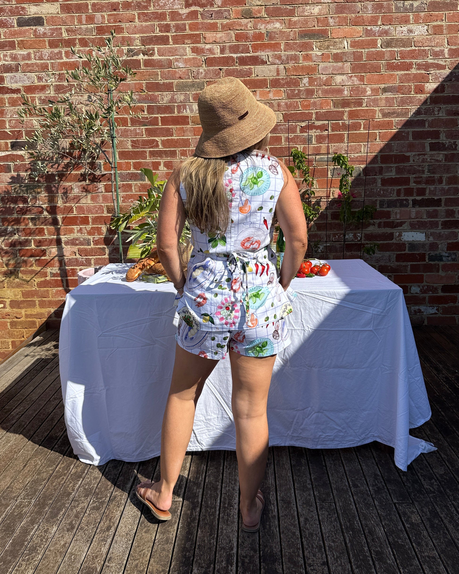 Cotton drill summer shorts in aperitivo print styled for long lunch and European summer look